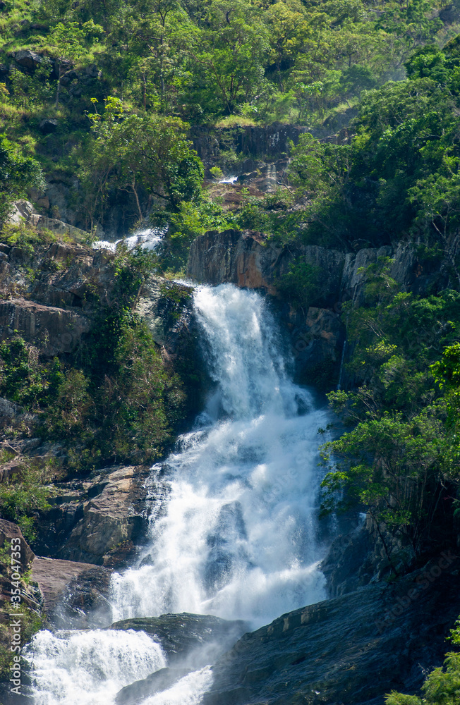 Waterfall on an forest covered mountain side at Kuranda in Queensland, Australia