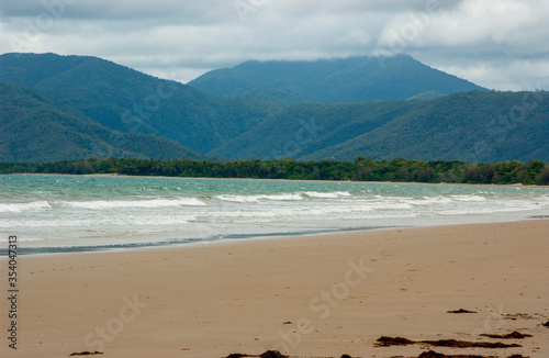 Four mile beach at Port Douglas with heavy storm clouds on the sky © It4All