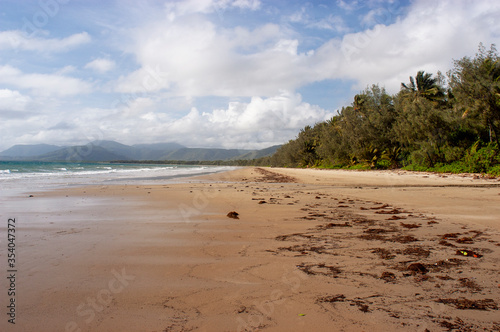 Four mile beach at Port Douglas with heavy storm clouds on the sky