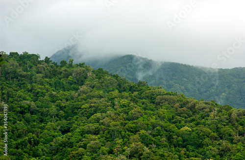 Clouds over summit on rainforest covered mountains at Daintree in Queensland, Australia