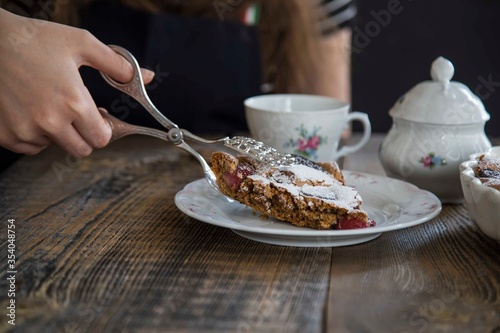 girl drinking cup of tea with brownie. food concept .