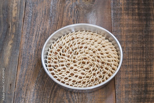 traditional  tray ravioli with pepper on wooden background. 