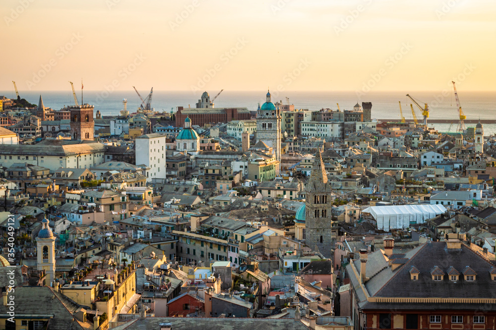 Genoa, Italy - CIRCA 2013: Genoa aerial cityscape at sunset as seen from Spianata Castelletto.