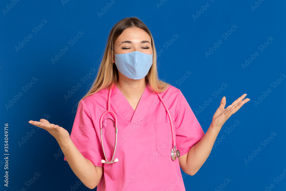 Young doctor wearing a mask face and a pink uniform Young doctor wearing a mask face and a pink uniform