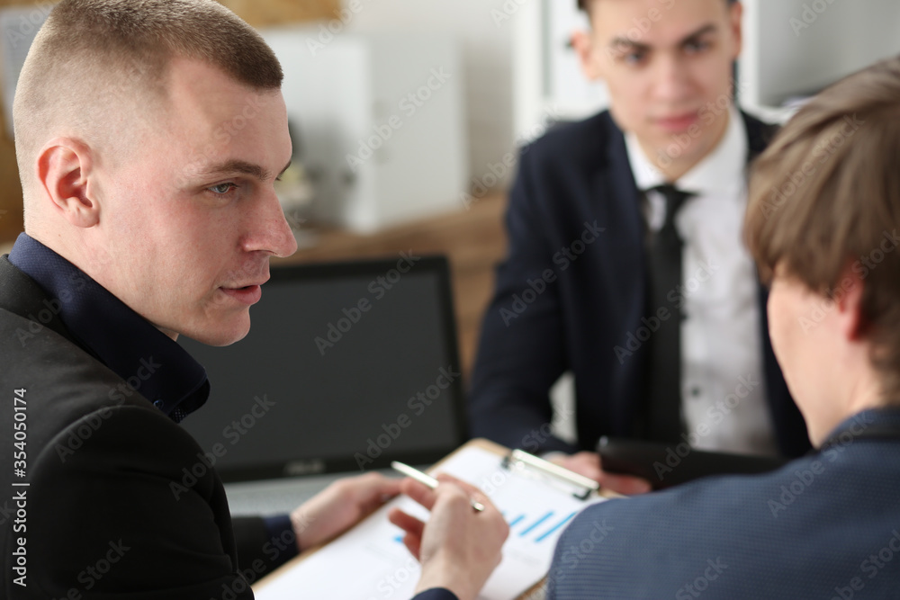 Group of people deliberate on problem