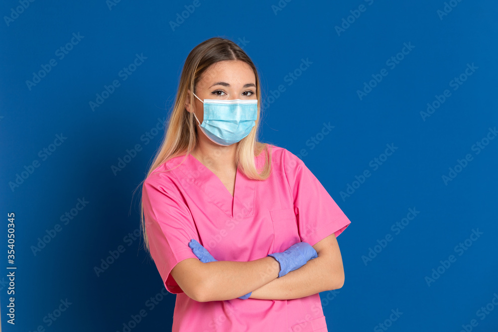Young doctor wearing a mask face and a pink uniform Young doctor wearing a mask face and a pink uniform
