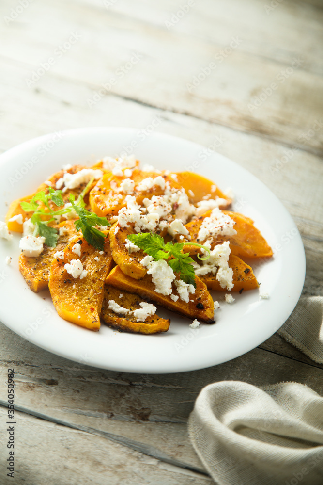 Roasted pumpkin with spices and fresh cheese Roasted pumpkin with spices and fresh cheese