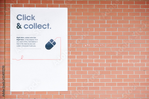 Click collect online internet shopping sign at shop
