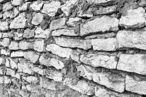old wall made of limestone. texture or background