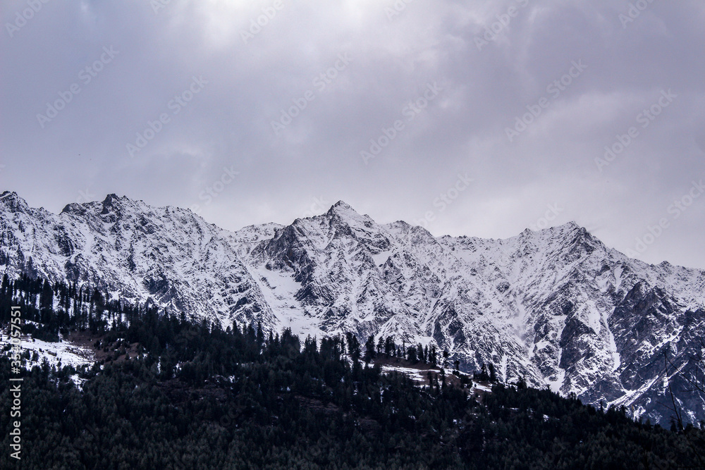 Landscape of mountain range covered with snow in Manali during summers