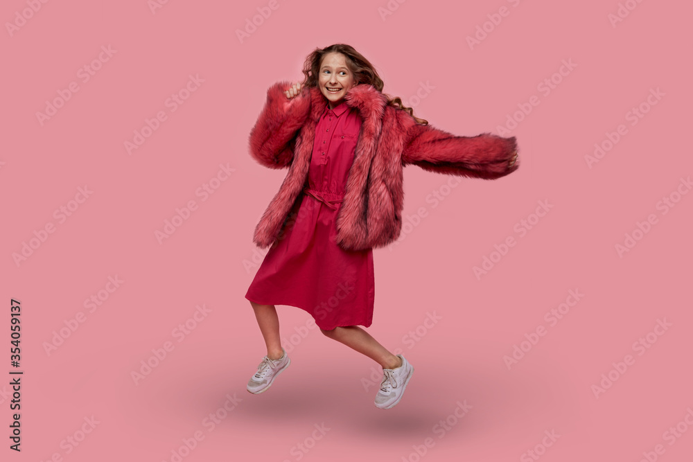 Cheerful girl fashion model with long blonde hair in fashionable clothes Cheerful girl fashion model with long blonde hair in fashionable clothes
