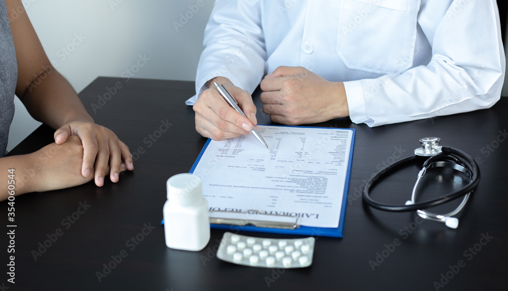 Doctor is currently consulting about the treatment of the patient's disease, Disease diagnosis and medical consultation concept.