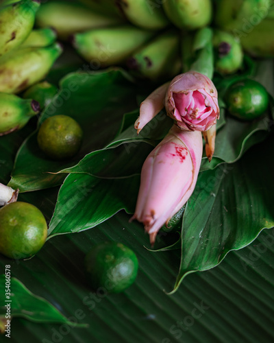 Asian  food ingredients, Bunga Kantan known as Torch Ginger flower with scientific name Etlingera herb on banana leaf background.