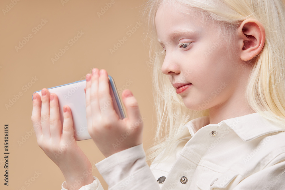 portrait of attractive caucasian albino girl with smartphone, girl with breathtaking beauty use mobile phone. perfect color combination portrait of attractive caucasian albino girl with smartphone, girl with breathtaking beauty use mobile phone. perfect color combination