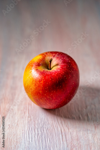 apple on a wooden pink background