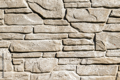white artificial stone with visible details. texture or background photo