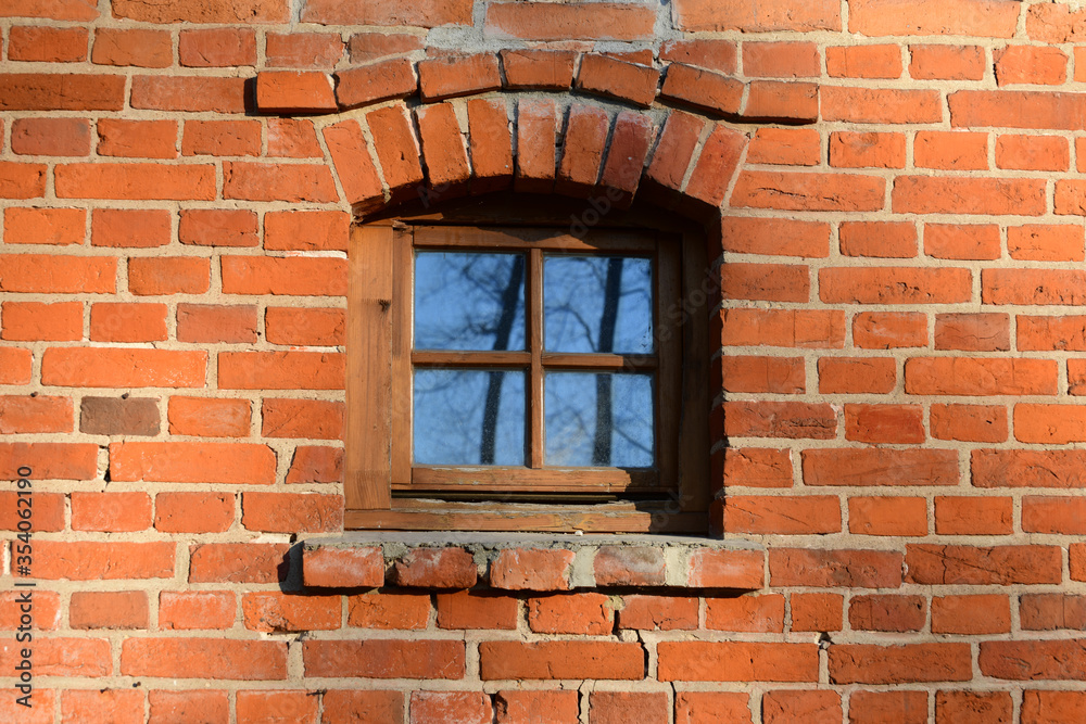 red brick masonry and window