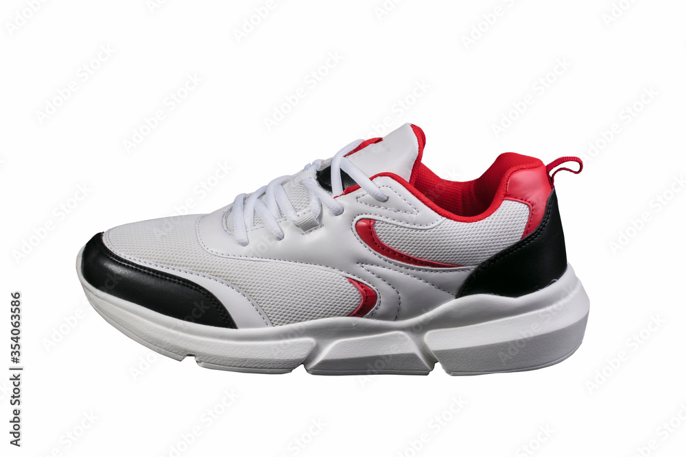 White sneaker with red and black accents on a white background. Sport shoes. White sneaker with red and black accents on a white background. Sport shoes.