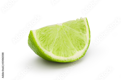 Lime slice into pieces with drop shadow on white background. Clipping path.