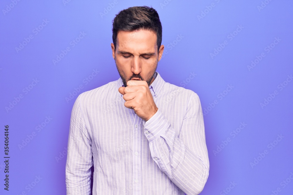 Young handsome man wearing casual striped shirt standing over isolated purple background feeling unwell and coughing as symptom for cold or bronchitis. Health care concept. Young handsome man wearing casual striped shirt standing over isolated purple background feeling unwell and coughing as symptom for cold or bronchitis. Health care concept.