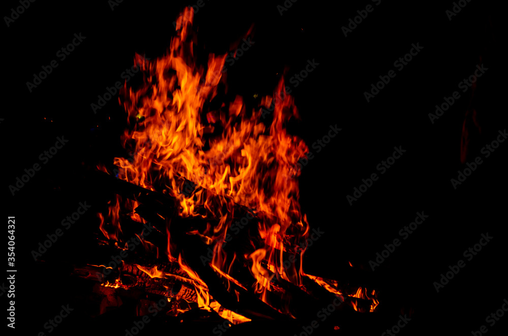 Bonfire. Hot fire against the black night sky. Bonfire. Hot fire against the black night sky.