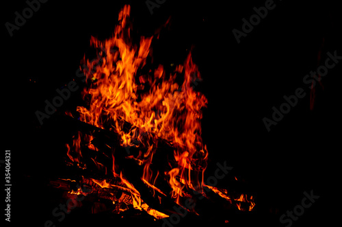 Bonfire. Hot fire against the black night sky.