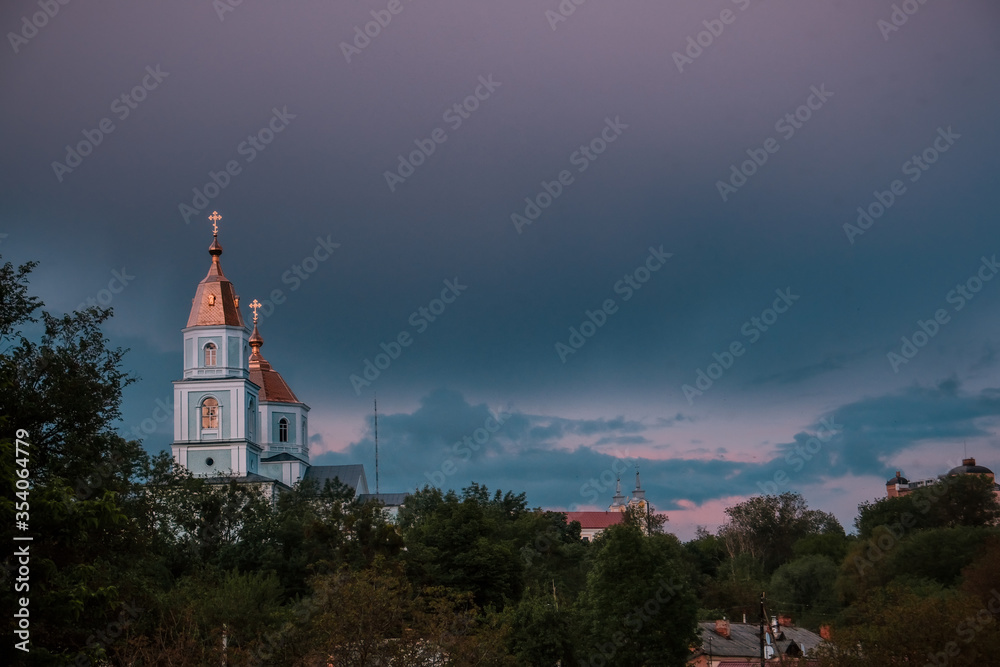Night city church on light background. Old town. Scenic cityscape.