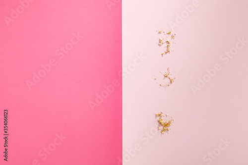 Aerial view of sweet cakes on a pink background © magdal3na