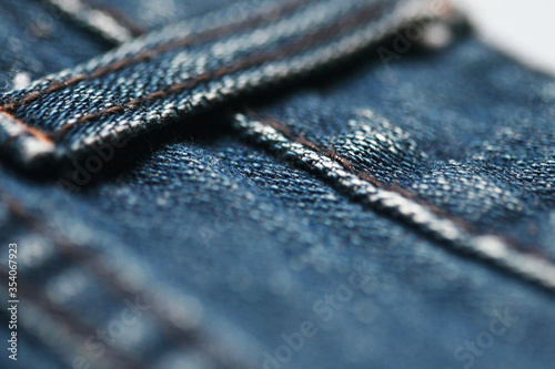 Jeans denim texture close up , focus only one point , soft blured background wallpaper