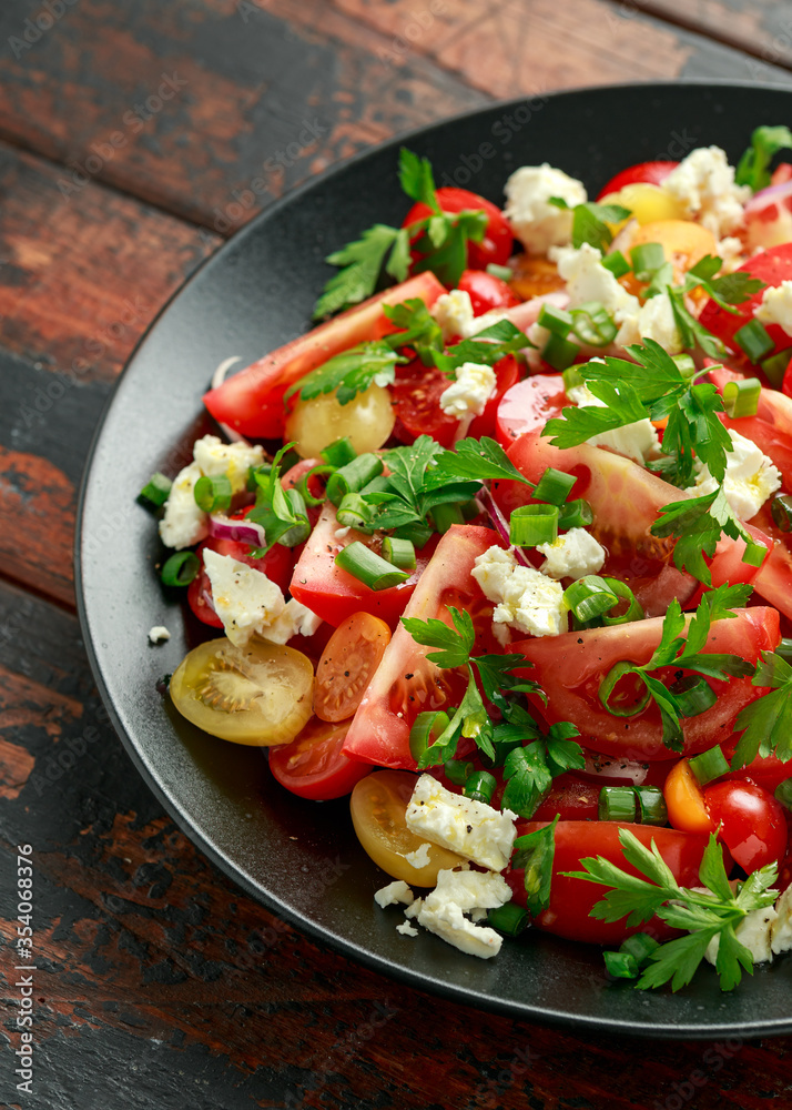 Tomato salad with feta cheese, spring onion and parsley. Healthy summer food Tomato salad with feta cheese, spring onion and parsley. Healthy summer food
