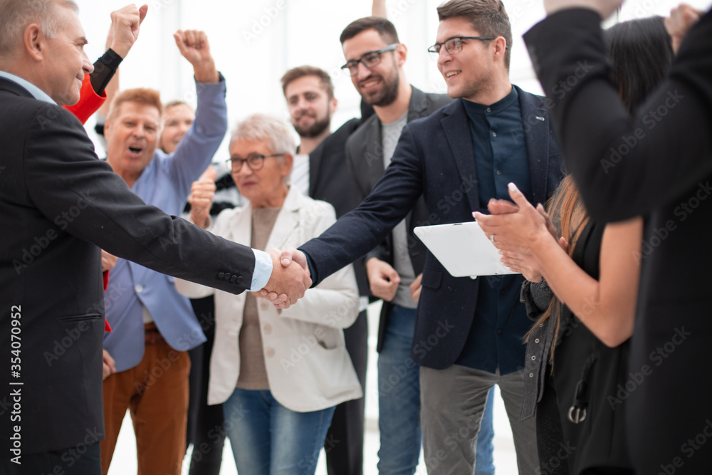 Businessteam is introducing a colleague to another businessman Businessteam is introducing a colleague to another businessman