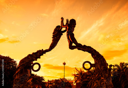 Entrance of the beach in Playa del Carmen at sunset, Mexico photo