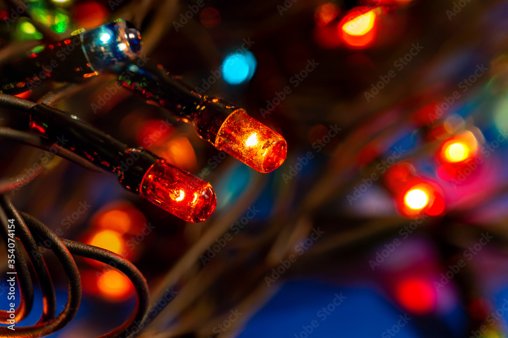 Fototapeta Multi-colored Christmas lights. Close-up. Macro