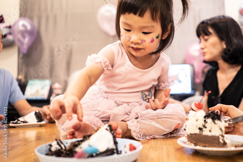 Group of people in big family, kids having fun happy birthday party.