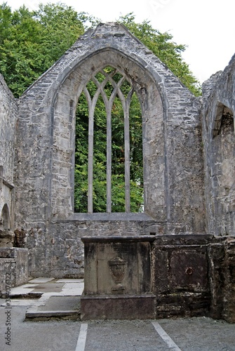 Stone wall of an old church ruin in Ireland photo