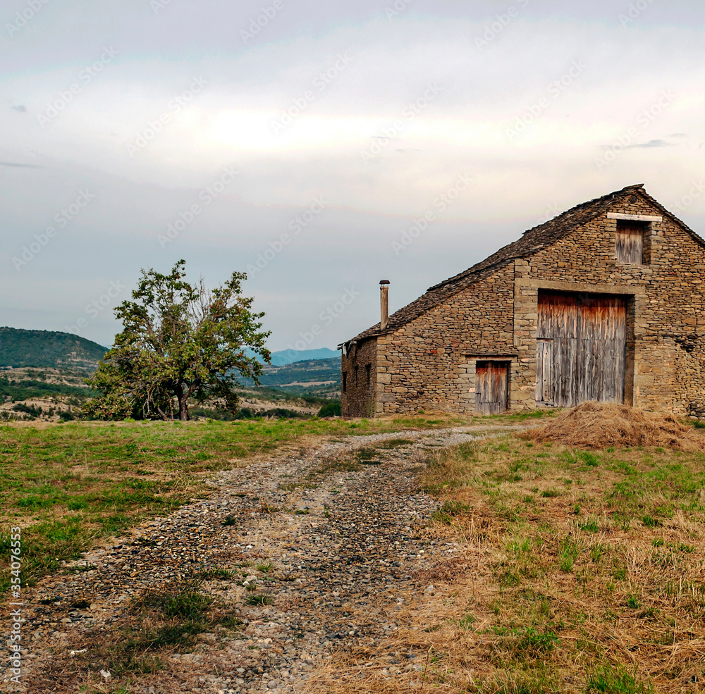 Village with stone houses in the Pyrenees mountains in a cloudy day Village with stone houses in the Pyrenees mountains in a cloudy day