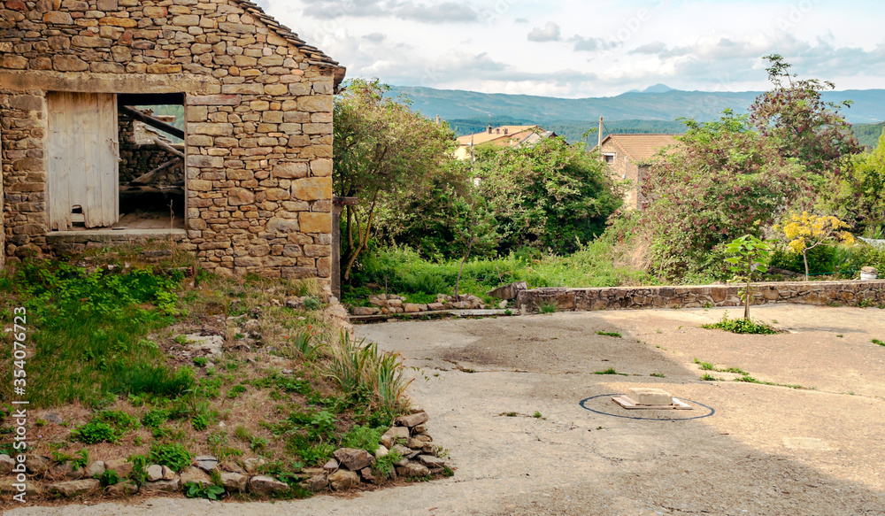 House in ruins in Gillue a village in the Pyrenees mountains in a cloudy day