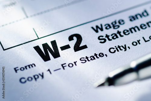 Pen on a Form W-2 Wage and Tax Statement photo