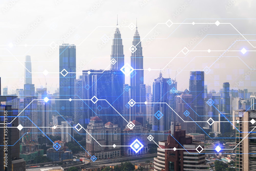 Fototapeta Technology hologram over panorama city view of Kuala Lumpur. KL is the largest tech hub in Malaysia, Asia. The concept of developing coding and high-tech science. Double exposure.