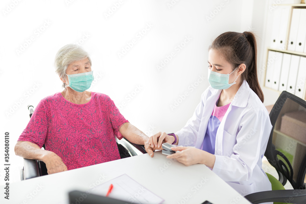 close up doctor, Asian doctor talk with old female patient about disease symptom, doctor use fingertip pulse oximeter with old patient, elderly health check up and health screening, medical technology