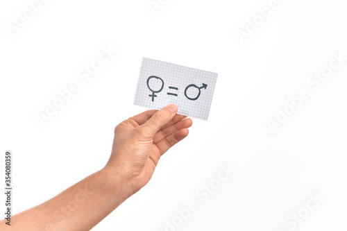 Cardboard banner with female and male symbol, women and men are equal message over isolated white background