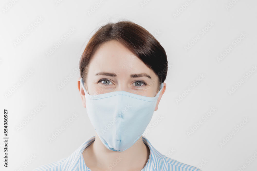 girl in a medical mask from kovid19 blue on a white background girl in a medical mask from kovid19 blue on a white background