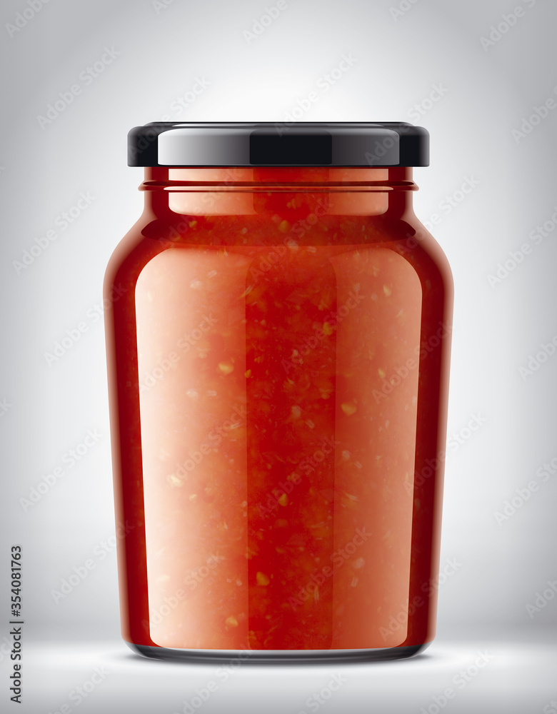 Glass Jar on Background with Tomato Sauce Glass Jar on Background with Tomato Sauce