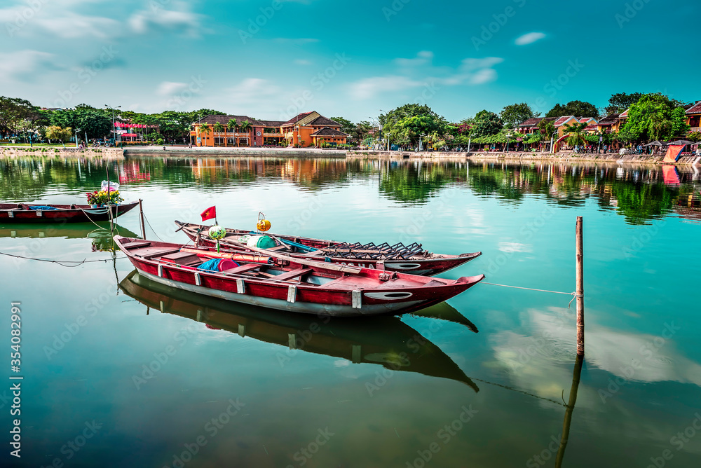 Two boats standing in the river in Hoi an in sunlight
