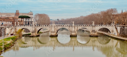 Bridge over the River Tiber with water reflection, Rome, Italy
