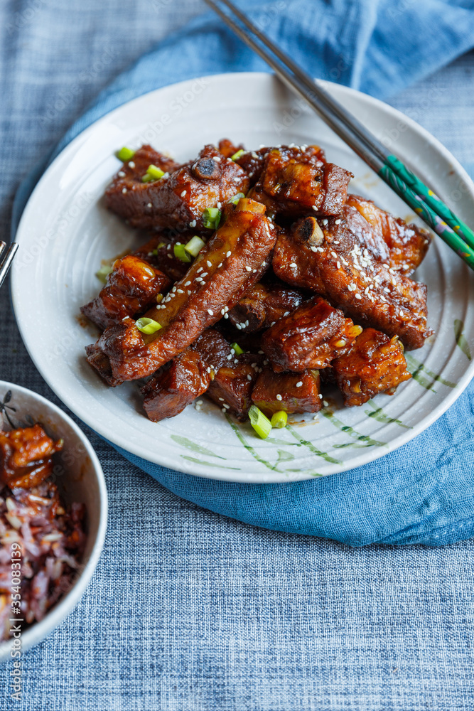 sweet and sour pork ribs in a plate under natural light sweet and sour pork ribs in a plate under natural light
