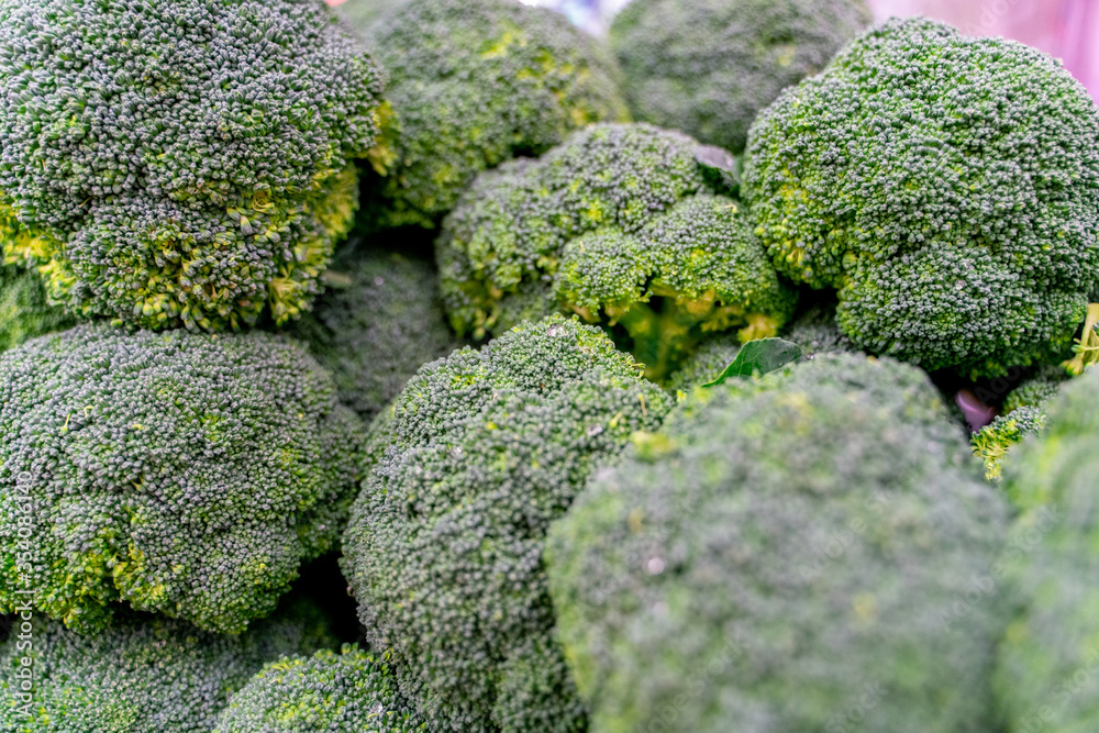 The view of supermarket stall full of fresh green cauliflower vegetables The view of supermarket stall full of fresh green cauliflower vegetables