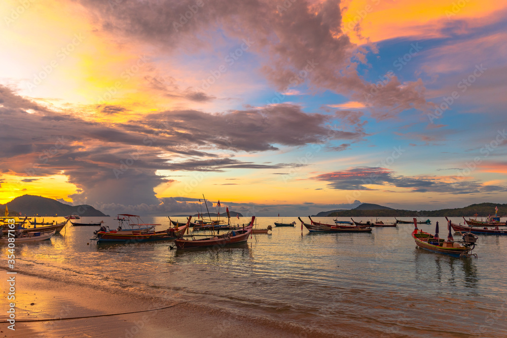 beautiful sunrise above fishing boats on Rawai beach, Phuket,Thailand..