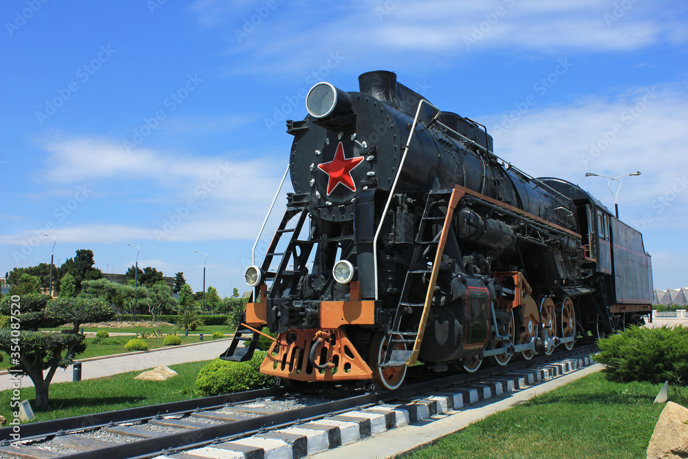 Obraz premium Azerbaijan. An old steam locomotive on the boulevard. Baku city.