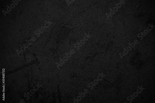 Black abstract background. Dark texture of rough surface.